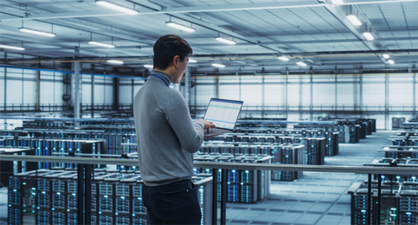 Technician maintaining data center systems